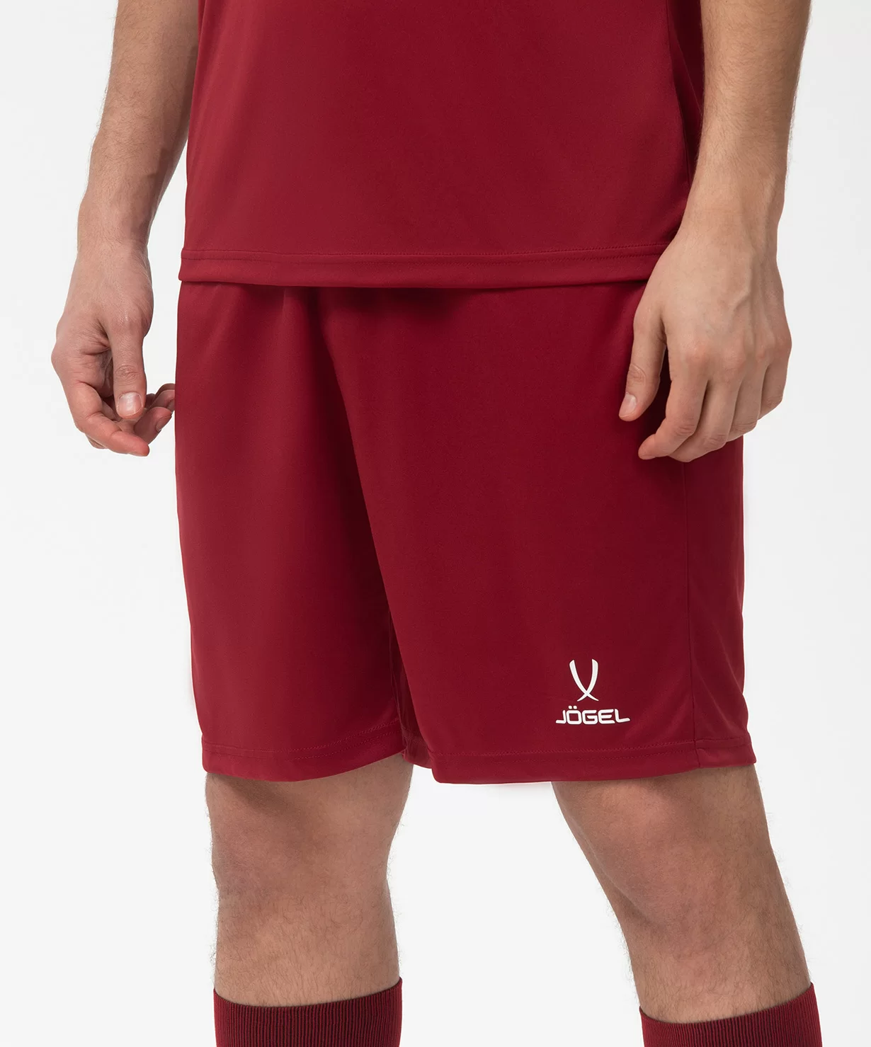Реальное фото Шорты игровые JÖGEL CAMP Classic Shorts, гранатовый/белый от магазина Спортев
