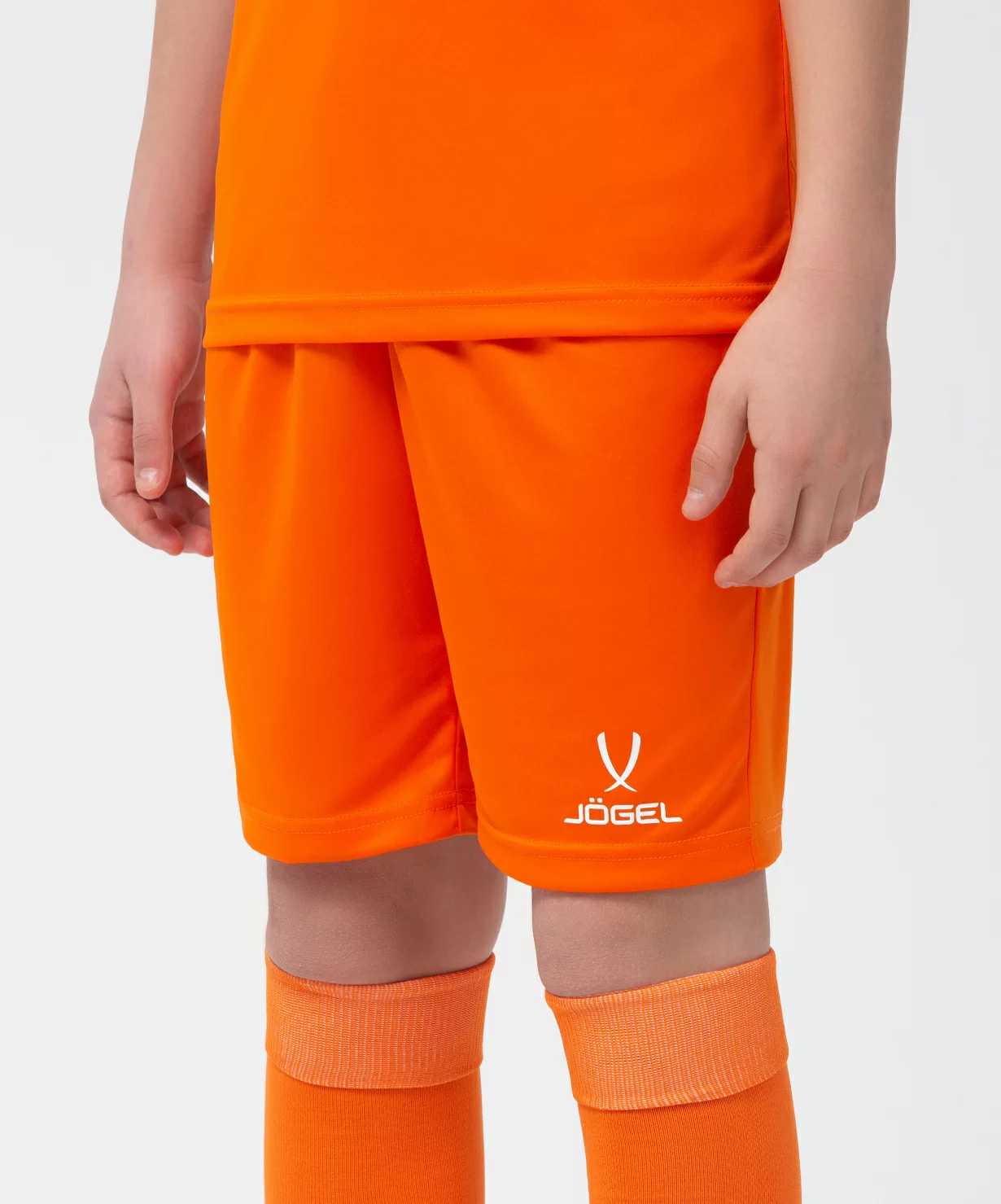 Реальное фото Шорты игровые JÖGEL CAMP Classic Shorts, оранжевый/белый, детский от магазина Спортев