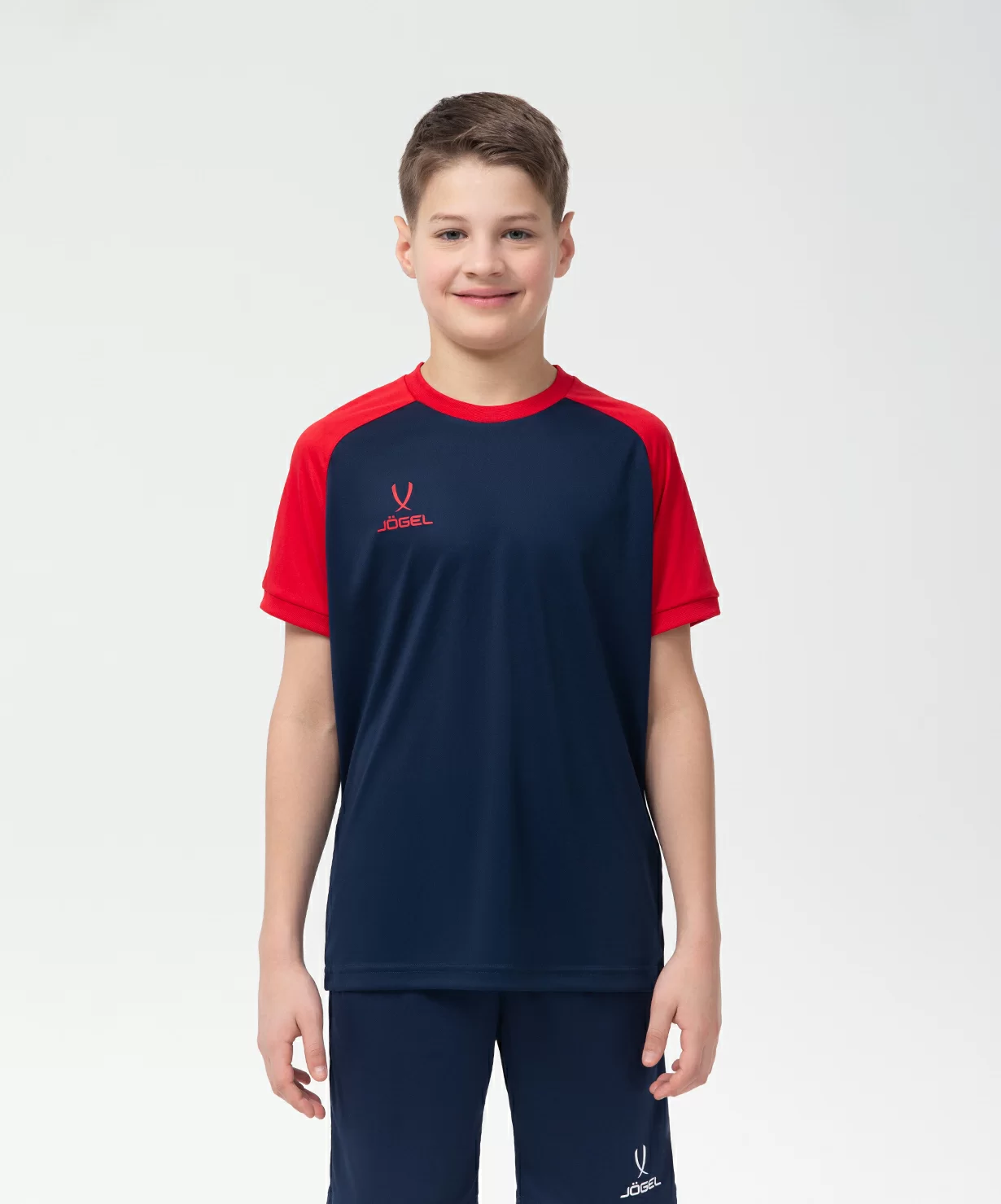 Реальное фото Футболка игровая JÖGEL CAMP Reglan Jersey, темно-синий/красный, детский от магазина Спортев