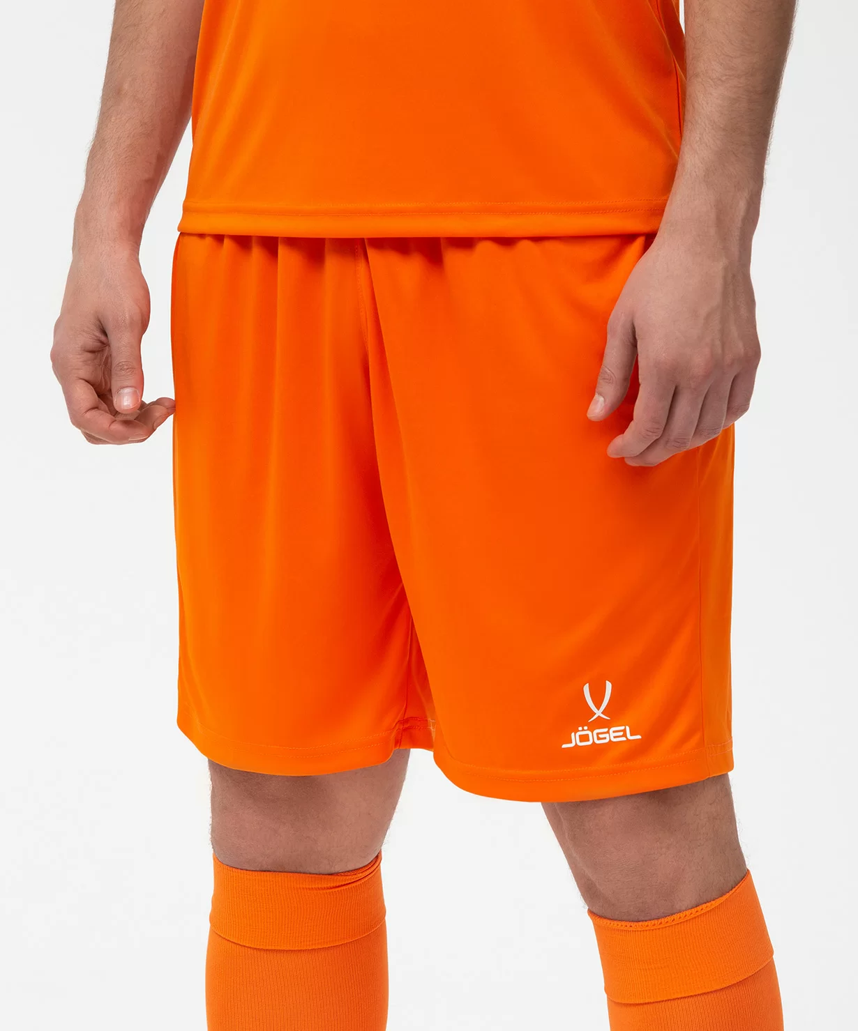 Реальное фото Шорты игровые JÖGEL CAMP Classic Shorts, оранжевый/белый от магазина Спортев