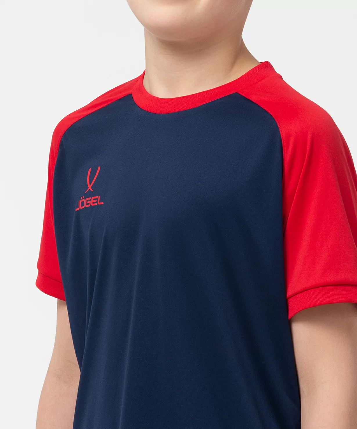 Реальное фото Футболка игровая JÖGEL CAMP Reglan Jersey, темно-синий/красный, детский от магазина Спортев