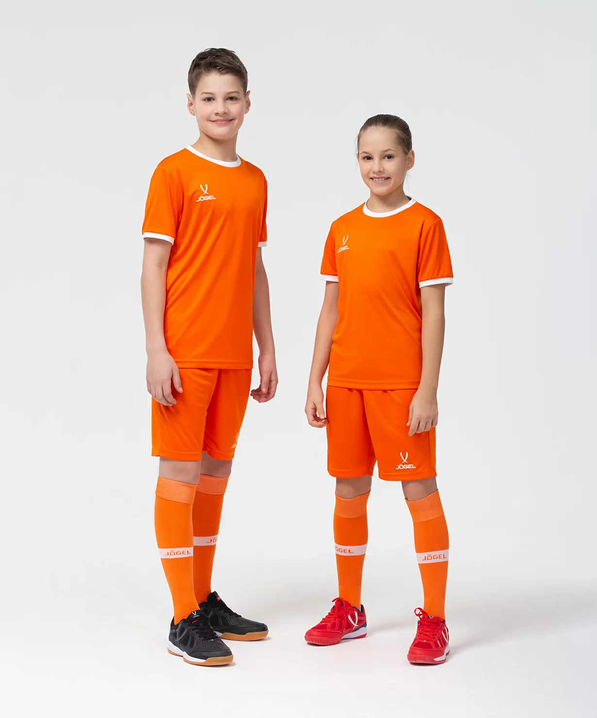 Реальное фото Шорты игровые JÖGEL CAMP Classic Shorts, оранжевый/белый, детский от магазина Спортев