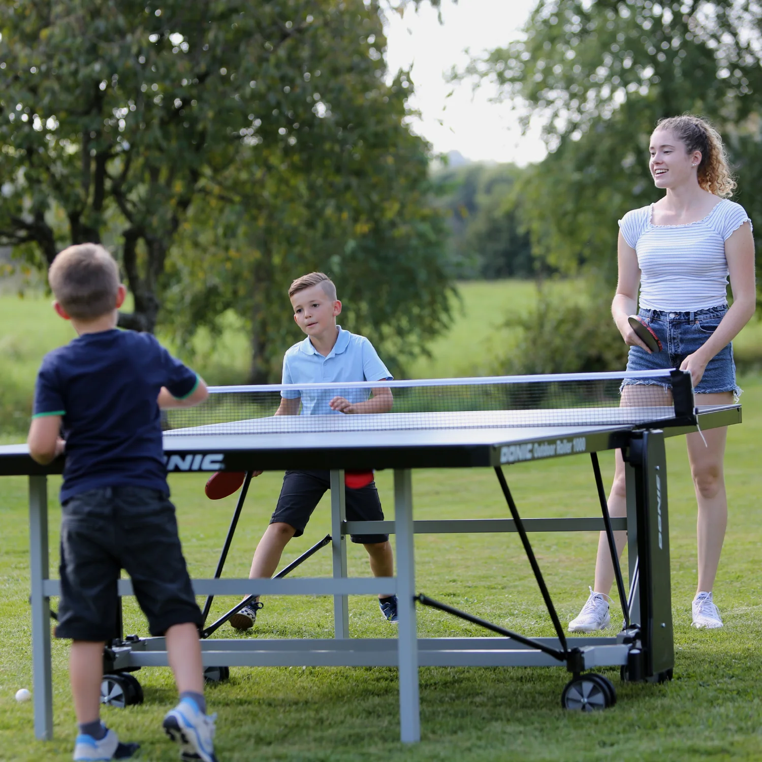 Реальное фото Теннисный стол DONIC OUTDOOR ROLLER 1000 BLUE 230291-B от магазина Спортев