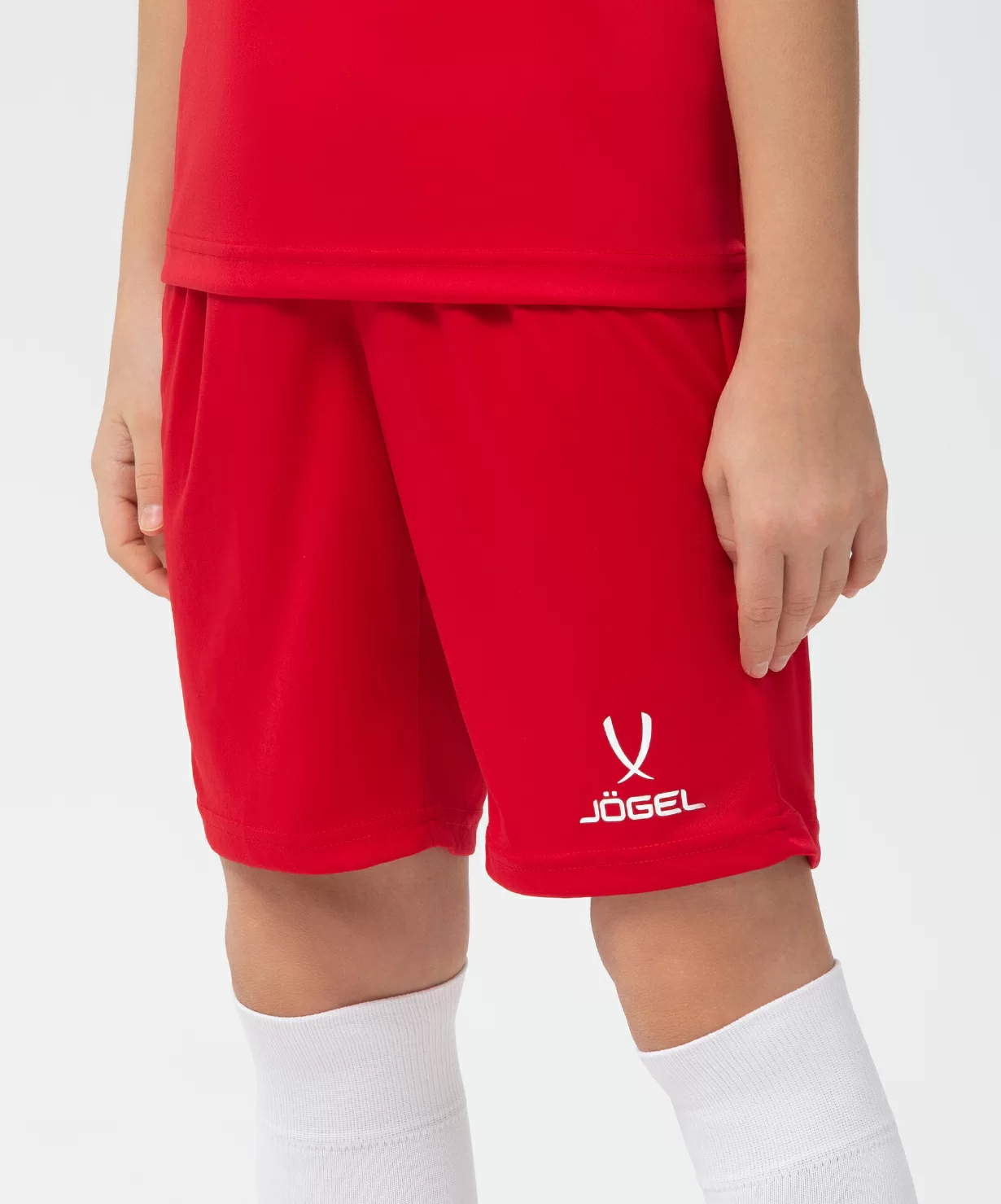 Реальное фото Шорты игровые JÖGEL CAMP Classic Shorts, красный/белый, детский от магазина Спортев