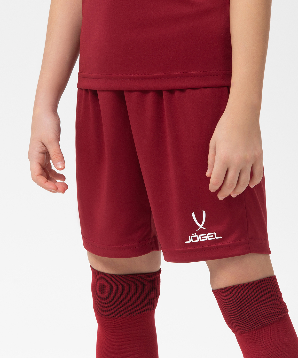 Реальное фото Шорты игровые JÖGEL CAMP Classic Shorts, гранатовый/белый, детский от магазина Спортев