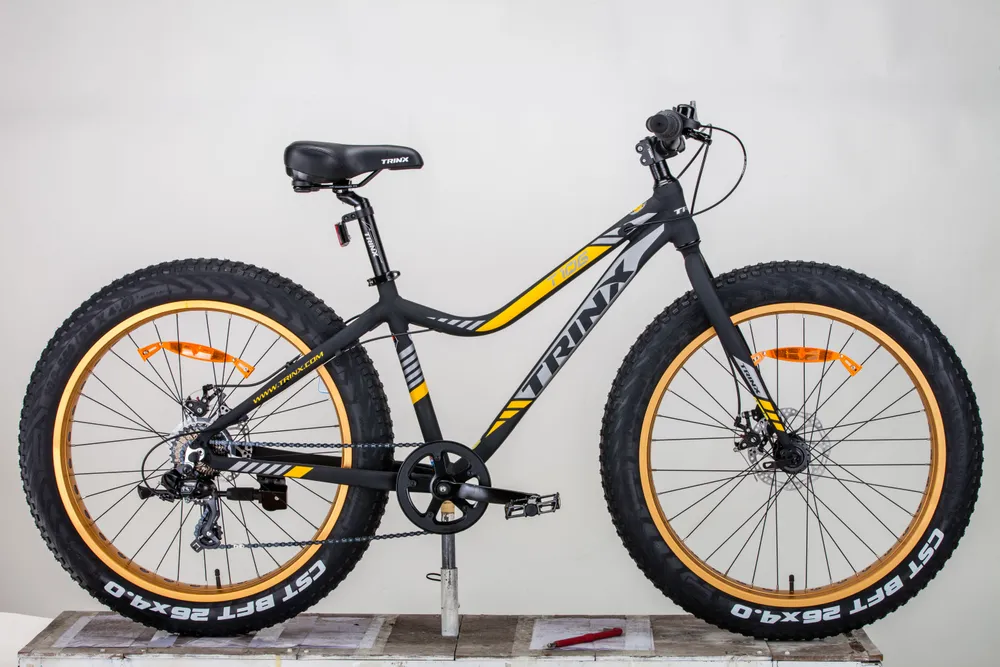 Реальное фото Велосипед TRINX FAT T106 26" матовый черный/серый/золотой от магазина СпортЕВ